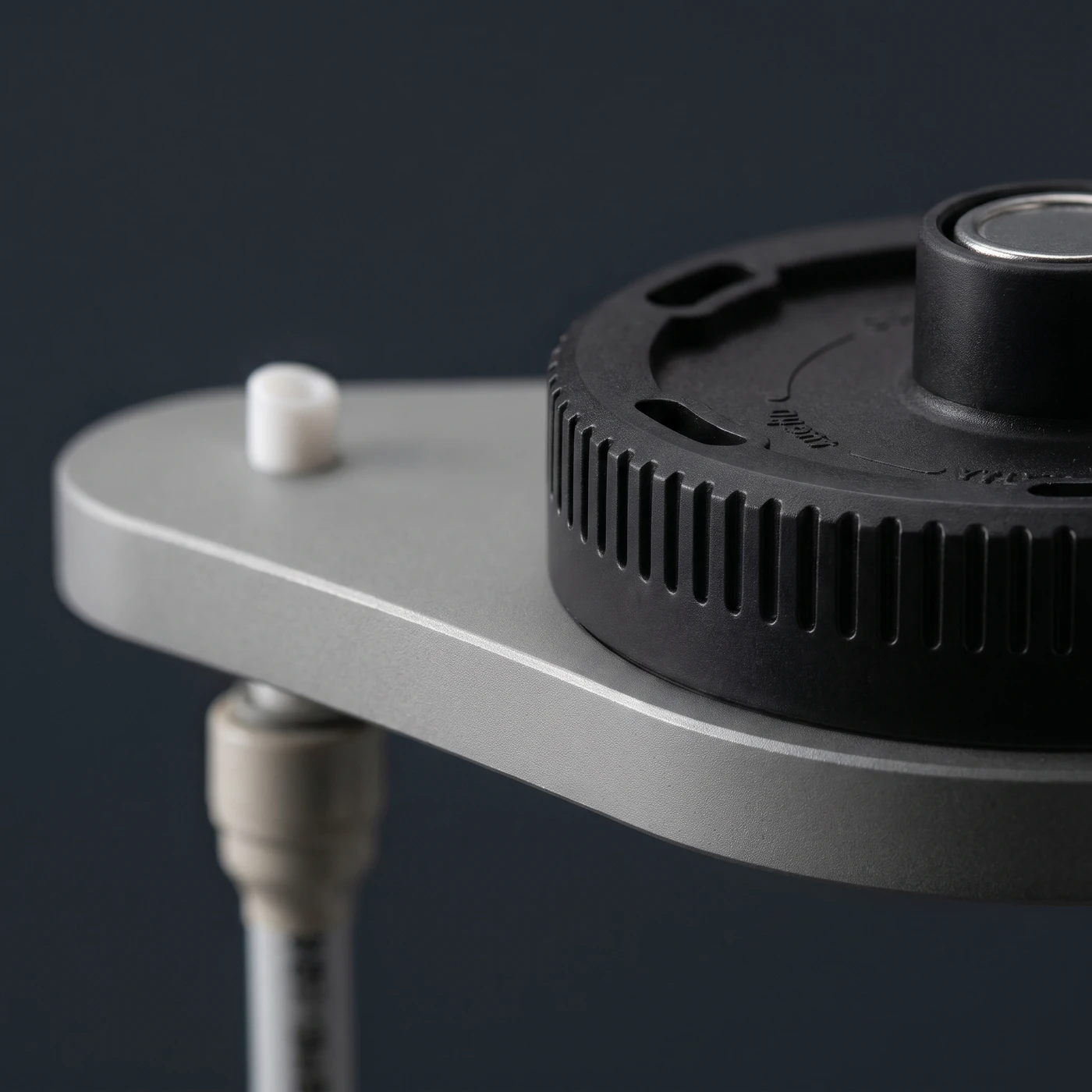 The wall-mount plate and its keyhole slot